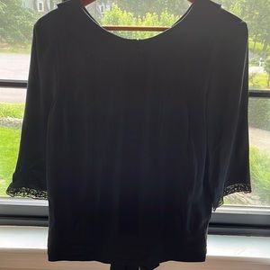 XS black 3/4 sleeve blouse with lace and pleats on front.